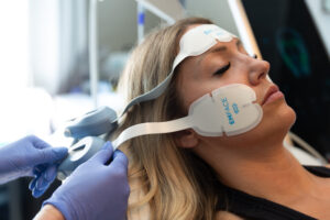 A woman receives Emface in Lakewood, CO